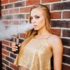 vaping-young-beautiful-woman-smoking-e-cigarette-with-smoke-outdoors-vapor-concept-min
